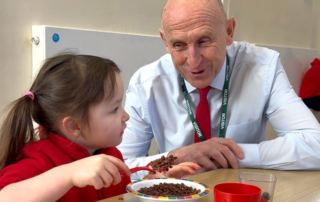John Healey chats with a pupil at Edlington Victoria Academy