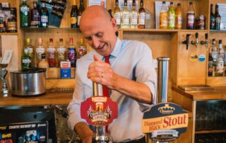 John Healey pulls a pint of Chancellor's Choice