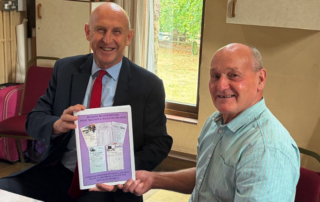 John Healey MP receives a signed copy of Bygone Businesses from the author Douglas Wydell